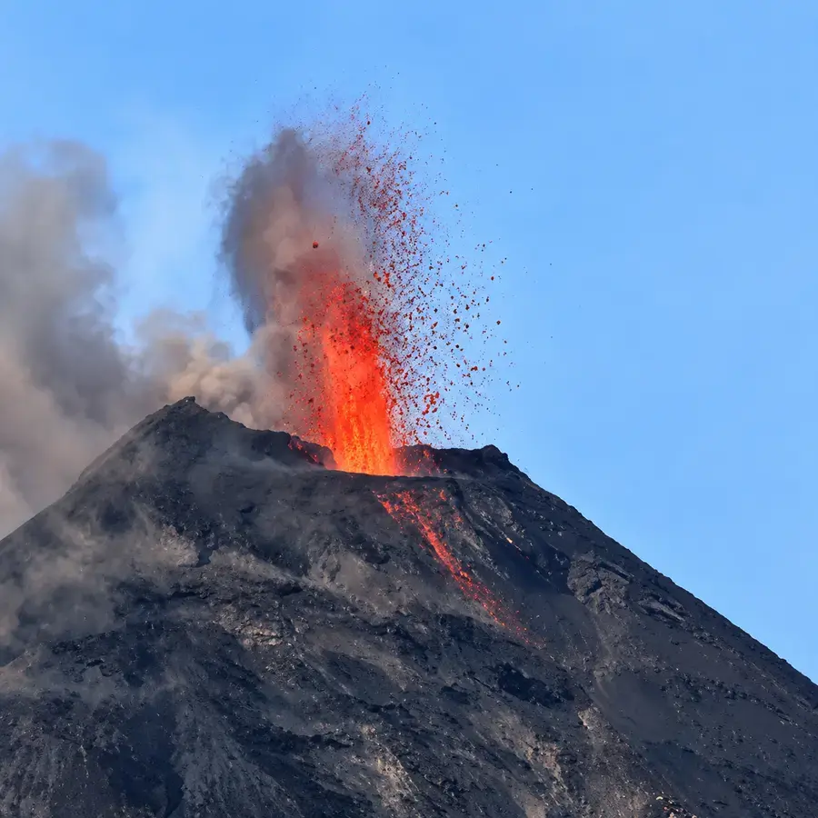 An ash plume rising from the crater, Barren Island