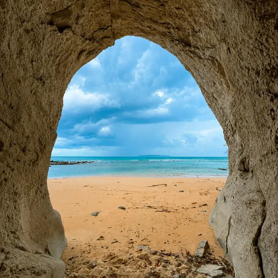 Rock arch framing the beach at low tide, Shaheed Dweep (Neil Island)